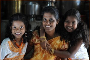 Jayanthi, a loan officer at Opportunity India’s Saidapet branch, started as a Trust Group client. She’s pictured here with her two young daughters Lavanya and Abinaya.