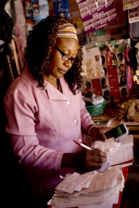 Felicitus Mmboge working in her Nairobi shop.